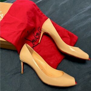 Slightly worn Christian Louboutin kitten heel.